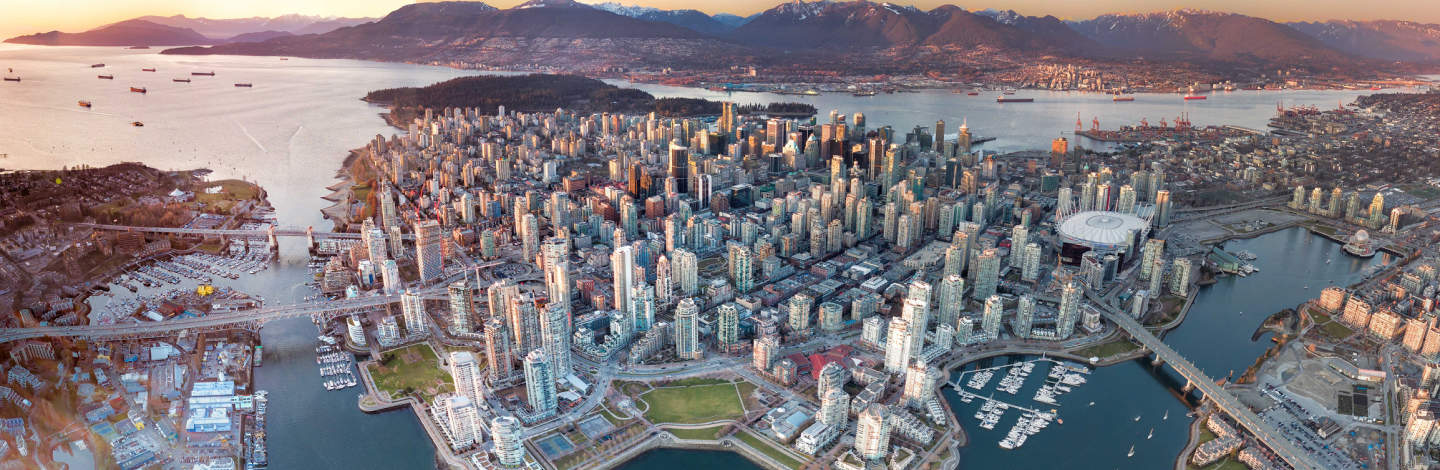 Aerial Picture of Downtown Vancouver with North Shore in the background.